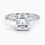 Asher cut Moissanite lab grown diamond engagement ring round shank with a four claw setting, on a gold band, against a white background.Moissanite engagement ring cape town south africa grand diamonds ralph jacobs jeulia