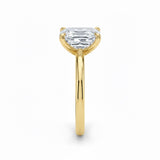 Asher  cut Moissanite lab grown diamond engagement ring round shank with a four claw setting, on a gold band, against a white background.Moissanite engagement ring cape town south africa grand diamonds ralph jacobs jeulia