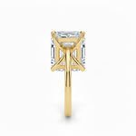 Asher  cut Moissanite lab grown diamond engagement ring round shank with a four claw setting, on a gold band, against a white background.Moissanite engagement ring cape town south africa grand diamonds ralph jacobs jeulia