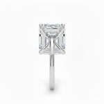 Asher  cut Moissanite lab grown diamond engagement ring round shank with a four claw setting, on a gold band, against a white background.Moissanite engagement ring cape town south africa grand diamonds ralph jacobs jeulia