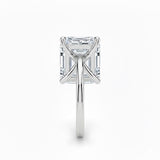 Asher  cut Moissanite lab grown diamond engagement ring round shank with a four claw setting, on a gold band, against a white background.Moissanite engagement ring cape town south africa grand diamonds ralph jacobs jeulia