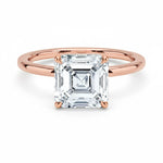 Asher  cut Moissanite lab grown diamond engagement ring round shank with a four claw setting, on a gold band, against a white background.Moissanite engagement ring cape town south africa grand diamonds ralph jacobs jeulia