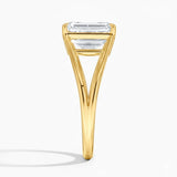 Emerald cut Moissanite lab grown diamond engagement ring round shank with a four claw setting, on a gold band, against a white background.Moissanite engagement ring cape town south africa grand diamonds ralph jacobs jeulia