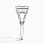 Emerald cut Moissanite lab grown diamond engagement ring round shank with a four claw setting, on a gold band, against a white background.Moissanite engagement ring cape town south africa grand diamonds ralph jacobs jeulia