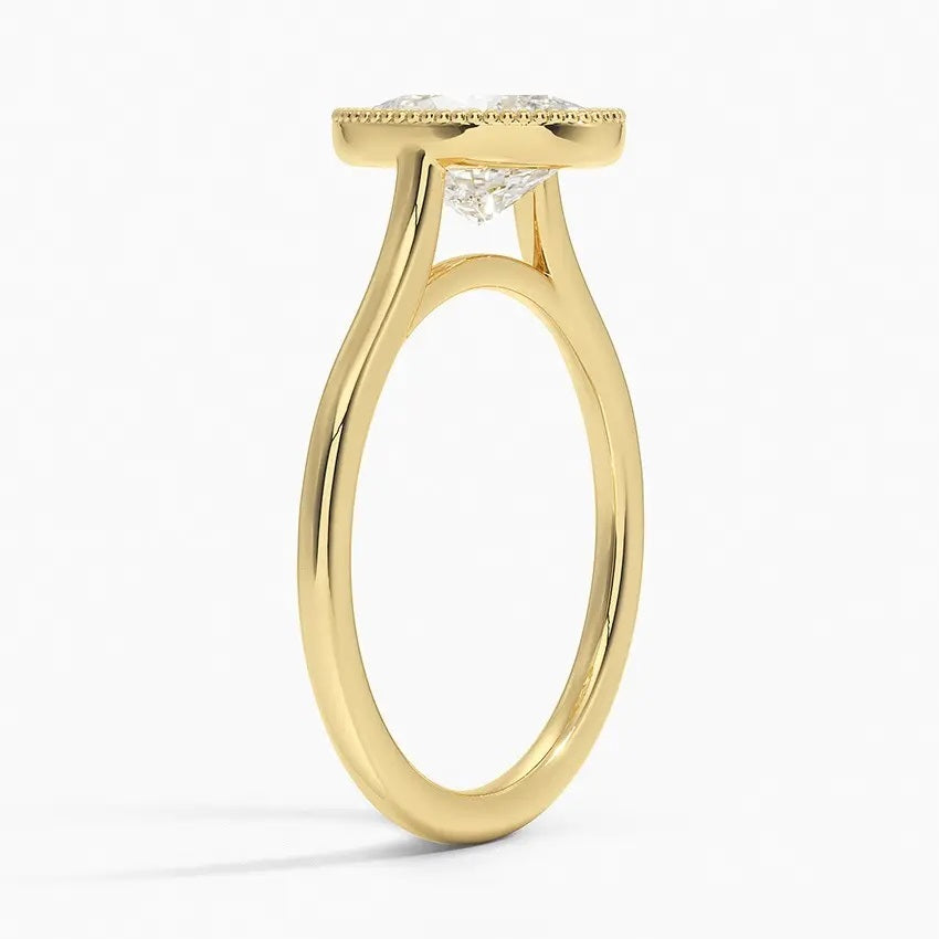 Oval shape Moissanite lab grown diamond engagement ring round shank with a bezel setting, on a gold band, against a white background.Moissanite engagement ring cape town south africa grand diamonds ralph jacobs jeulia