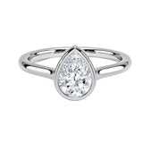 Pear shape Moissanite lab grown diamond engagement ring round shank with a bezel setting, on a gold band, against a white background.Moissanite engagement ring cape town south africa grand diamonds ralph jacobs jeulia