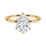 Pear cut Moissanite lab grown diamond engagement ring round shank with a six claw setting, on a gold band, against a white background.Moissanite engagement ring cape town south africa grand diamonds ralph jacobs jeuli