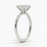 Princess cut Moissanite lab grown diamond engagement ring round shank with a four claw setting, on a gold band, against a white background.Moissanite engagement ring cape town south africa grand diamonds ralph jacobs jeuli