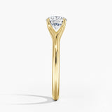 Round cut Split Shank Moissanite lab grown diamond engagement ring round shank with a six claw setting, on a gold band, against a white background.Moissanite engagement ring cape town south africa grand diamonds ralph jacobs jeuli