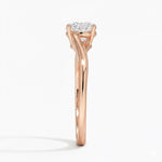 Round cut Twisted Shank Moissanite lab grown diamond engagement ring round shank with a four claw setting, on a gold band, against a white background.Moissanite engagement ring cape town south africa grand diamonds ralph jacobs jeuli