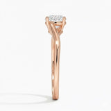 Round cut Twisted Shank Moissanite lab grown diamond engagement ring round shank with a four claw setting, on a gold band, against a white background.Moissanite engagement ring cape town south africa grand diamonds ralph jacobs jeuli