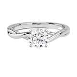 Round cut Twisted Shank Moissanite lab grown diamond engagement ring round shank with a four claw setting, on a gold band, against a white background.Moissanite engagement ring cape town south africa grand diamonds ralph jacobs jeuli