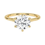 Round cut Moissanite lab grown diamond engagement ring round shank with a six claw setting, on a gold band, against a white background.Moissanite engagement ring cape town south africa grand diamonds ralph jacobs jeulia