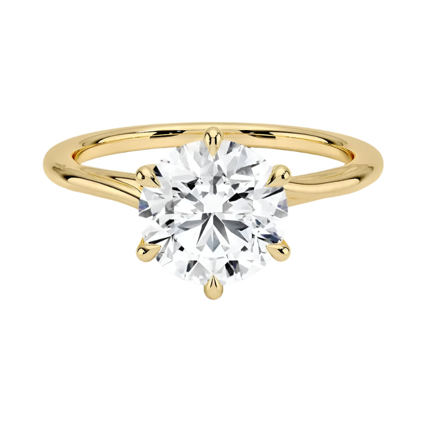 Round cut Moissanite lab grown diamond engagement ring round shank with a six claw setting, on a gold band, against a white background.Moissanite engagement ring cape town south africa grand diamonds ralph jacobs jeulia
