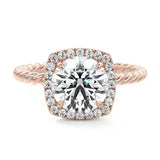 alt="Round-cut lab grown diamond engagement ring with a halo and a twisted pavé band by ApolloGem"
