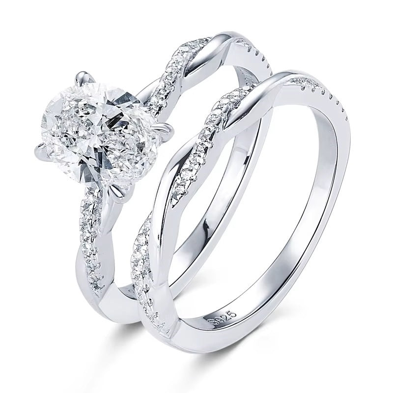 alt="Elegant oval cut engagement ring set with a twisted wedding band by ApolloGem"