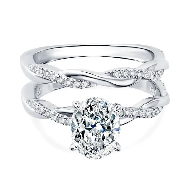 alt="Elegant oval cut engagement ring set with a twisted wedding band by ApolloGem"