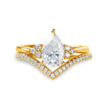 alt="Pear cut moissanite engagement ring set with a matching half eternity V-shaped wedding band by ApolloGem"