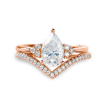 alt="Pear cut lab grown diamond engagement ring set with a matching half eternity V-shaped wedding band by ApolloGem"