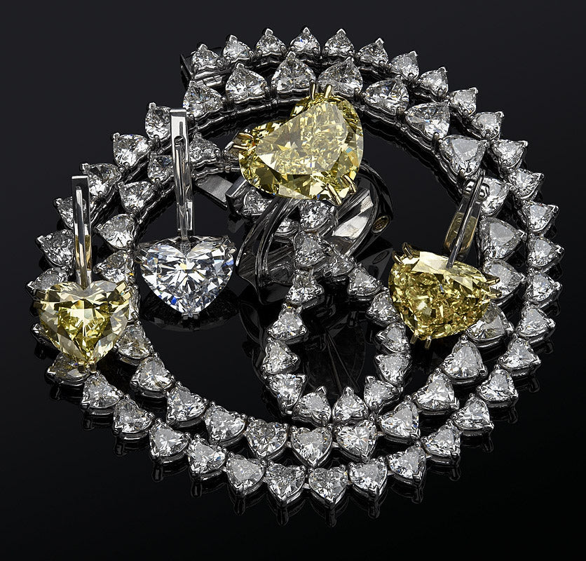 Exclusive ApolloGem jewellery set featuring a heart-shaped moissanite tennis necklace, matching heart-cut earrings, and a statement yellow heart moissanite ring, masterfully crafted in Cape Town.