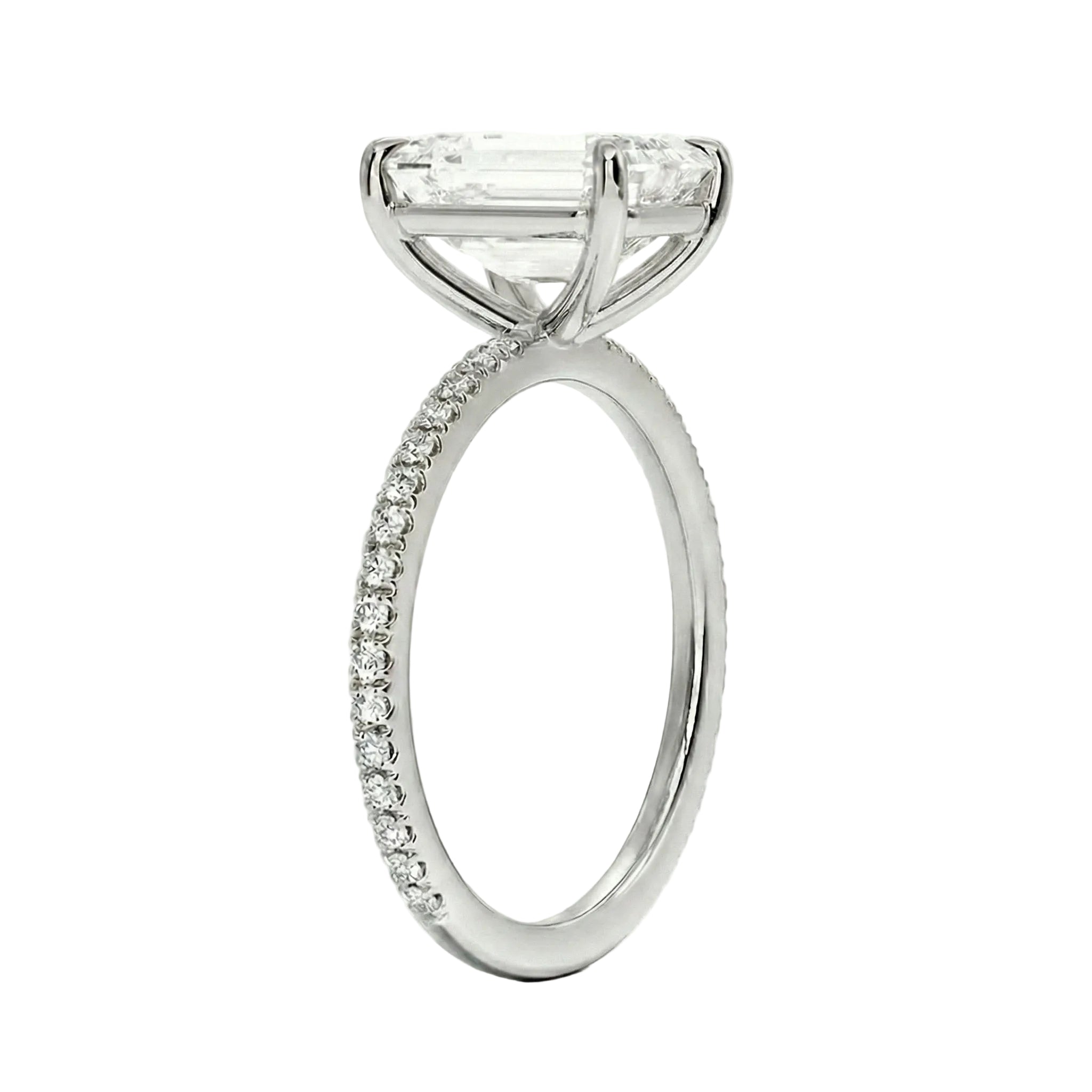 Diamond ring with a central gemstone and smaller diamonds on the band against a white background