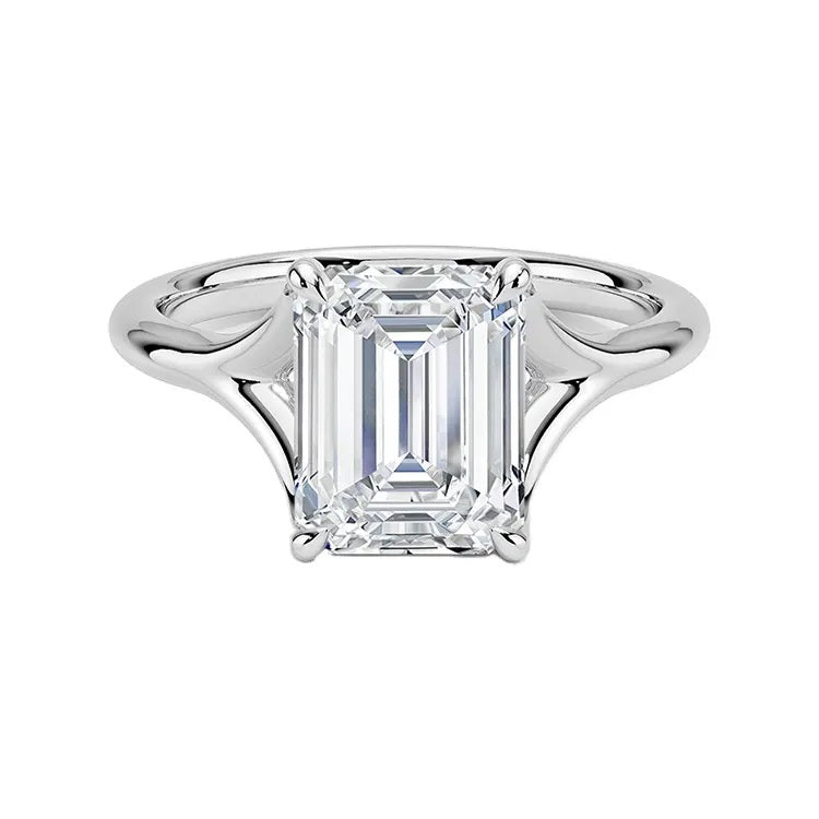 Emerald  cut Moissanite lab grown diamond engagement ring V-split band  with a four claw setting, on a gold band, against a white background.Moissanite engagement ring cape town south africa grand diamonds ralph jacobs jeulia  