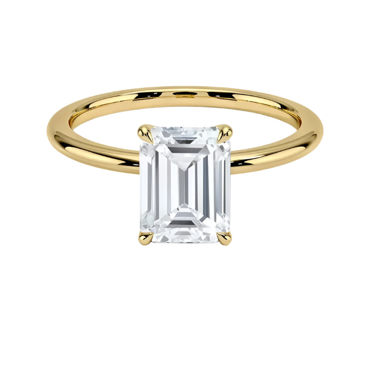 Emerald  cut Moissanite lab grown diamond engagement ring round shank with a four claw setting, on a gold band, against a white background.Moissanite engagement ring cape town south africa grand diamonds ralph jacobs jeulia 