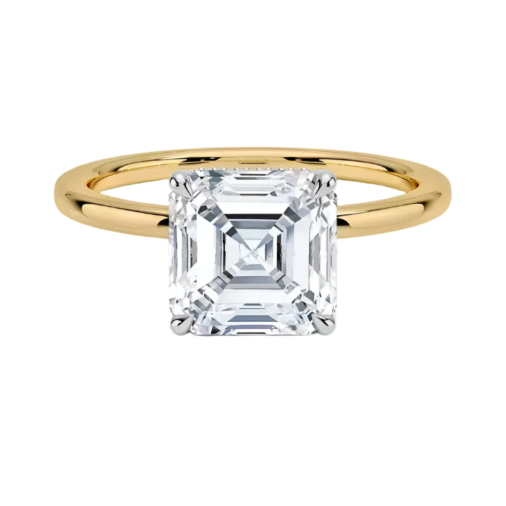 Asher  cut Moissanite lab grown diamond engagement ring round shank with a four claw setting, on a gold band, against a white background.Moissanite engagement ring cape town south africa grand diamonds ralph jacobs jeulia 
