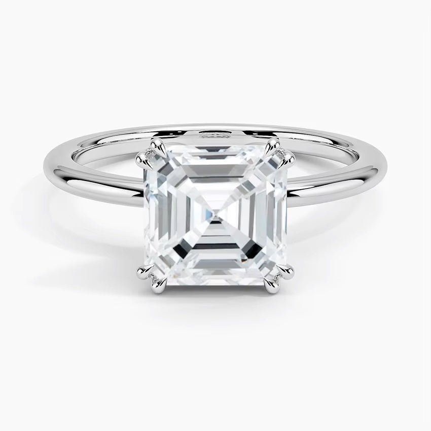 Asher cut Moissanite lab grown diamond engagement ring round shank with a four claw setting, on a gold band, against a white background.Moissanite engagement ring cape town south africa grand diamonds ralph jacobs jeulia 