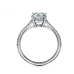 Elongated cushion cut Moissanite lab grown diamond engagement ring pave set shank with cathedral setting, on a gold band, against a white background.Moissanite engagement ring cape town south africa grand diamonds ralph jacobs jeulia 