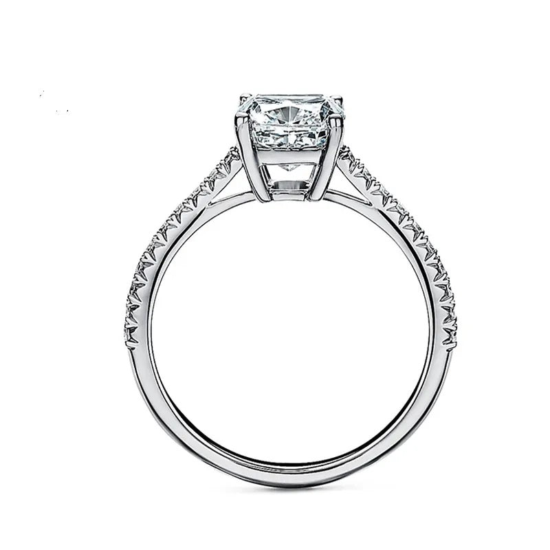 Elongated cushion cut Moissanite lab grown diamond engagement ring pave set shank with cathedral setting, on a gold band, against a white background.Moissanite engagement ring cape town south africa grand diamonds ralph jacobs jeulia 