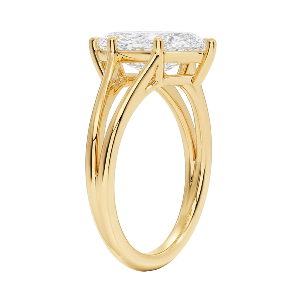 Marquise cut Moissanite lab grown diamond engagement ring V-Split shank with six cat claw setting, on a gold band, against a white background.Moissanite engagement ring cape town south africa grand diamonds ralph jacobs jeulia