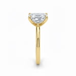 Asher  cut Moissanite lab grown diamond engagement ring round shank with a four claw setting, on a gold band, against a white background.Moissanite engagement ring cape town south africa grand diamonds ralph jacobs jeulia 