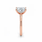 Asher  cut Moissanite lab grown diamond engagement ring round shank with a four claw setting, on a gold band, against a white background.Moissanite engagement ring cape town south africa grand diamonds ralph jacobs jeulia 