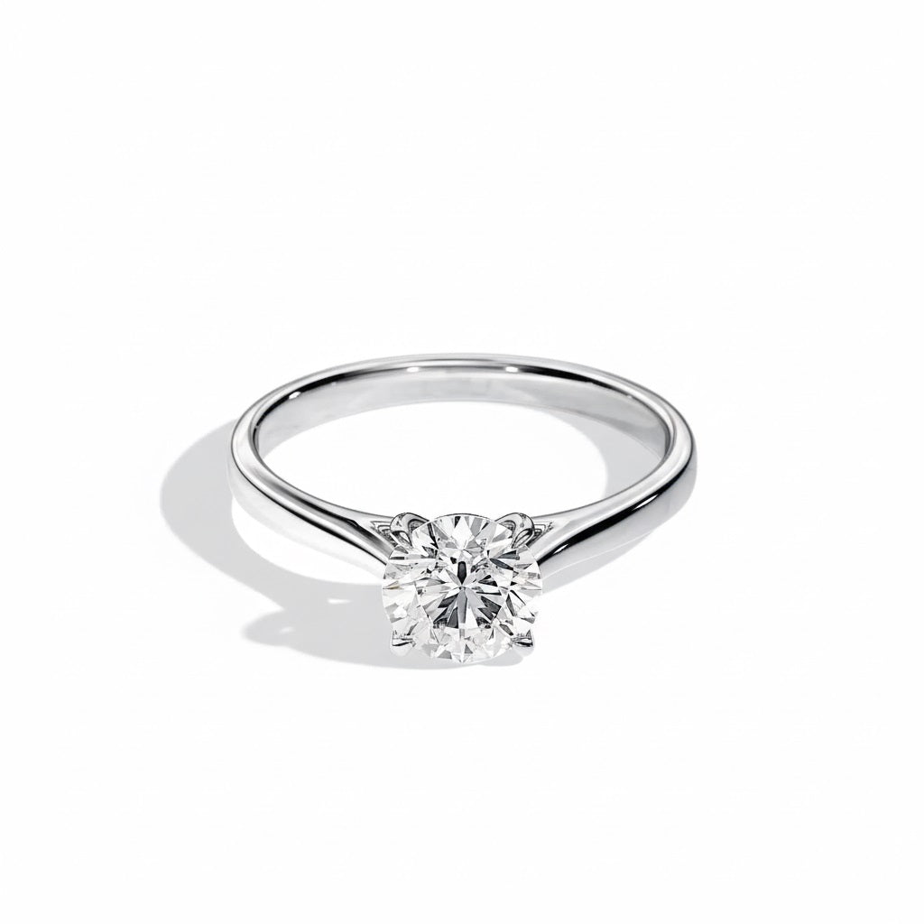 Engagement ring Cathedral setting round cut Moissanite lab grown diamond engagement ring round shank with a four claw setting, on a gold band, against a white background.Moissanite engagement ring cape town south africa grand diamonds ralph jacobs jeulia 