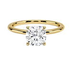 Cushion cut Moissanite lab grown diamond engagement ring round shank with a four claw setting, on a gold band, against a white background.Moissanite engagement ring cape town south africa grand diamonds ralph jacobs jeulia 