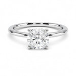 Cushion cut Moissanite lab grown diamond engagement ring round shank with a four claw setting, on a gold band, against a white background.Moissanite engagement ring cape town south africa grand diamonds ralph jacobs jeulia 