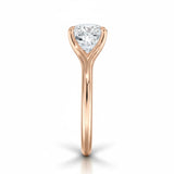 Engagement ring Cushion cut Moissanite lab grown diamond engagement ring v-Split round shank with a four cat-claw setting, on a gold band, against a white background.Moissanite engagement ring cape town south africa grand diamonds ralph jacobs jeulia 