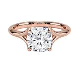 Engagement ring Cushion cut Moissanite lab grown diamond engagement ring v-Split round shank with a four cat-claw setting, on a gold band, against a white background.Moissanite engagement ring cape town south africa grand diamonds ralph jacobs jeulia 