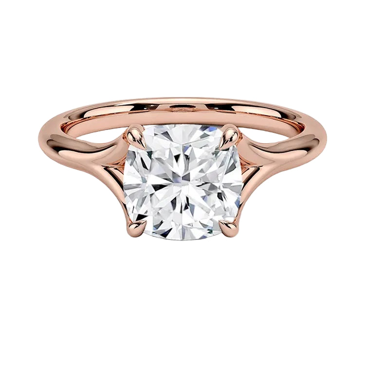 Engagement ring Cushion cut Moissanite lab grown diamond engagement ring v-Split round shank with a four cat-claw setting, on a gold band, against a white background.Moissanite engagement ring cape town south africa grand diamonds ralph jacobs jeulia 