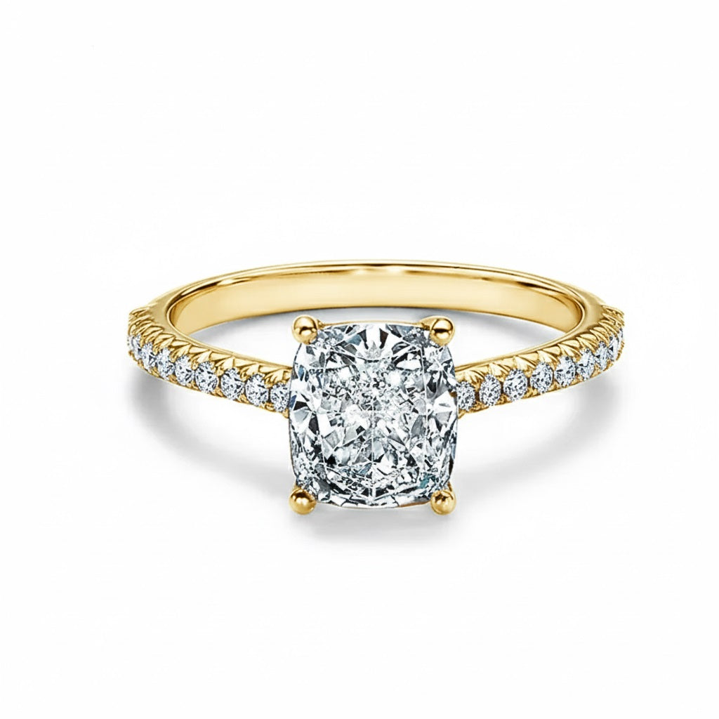Elongated cushion cut Moissanite lab grown diamond engagement ring pave set shank with cathedral setting, on a gold band, against a white background.Moissanite engagement ring cape town south africa grand diamonds ralph jacobs jeulia 