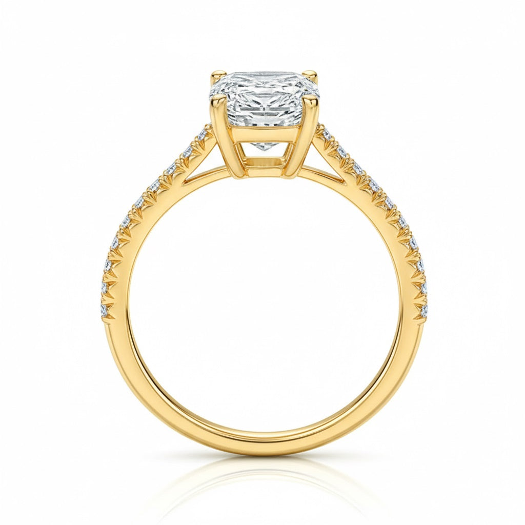 Elongated cushion cut Moissanite lab grown diamond engagement ring pave set shank with cathedral setting, on a gold band, against a white background.Moissanite engagement ring cape town south africa grand diamonds ralph jacobs jeulia 