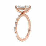 Emerald cut Moissanite lab grown diamond engagement ring with fancy baguette and round cut moissanite set pave gold band, against a white background.Moissanite engagement ring cape town south africa grand diamonds ralph jacobs jeulia 