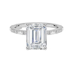 Emerald cut Moissanite lab grown diamond engagement ring with fancy baguette and round cut moissanite set pave gold band, against a white background.Moissanite engagement ring cape town south africa grand diamonds ralph jacobs jeulia 
