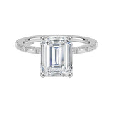 Emerald cut Moissanite lab grown diamond engagement ring with fancy baguette and round cut moissanite set pave gold band, against a white background.Moissanite engagement ring cape town south africa grand diamonds ralph jacobs jeulia 
