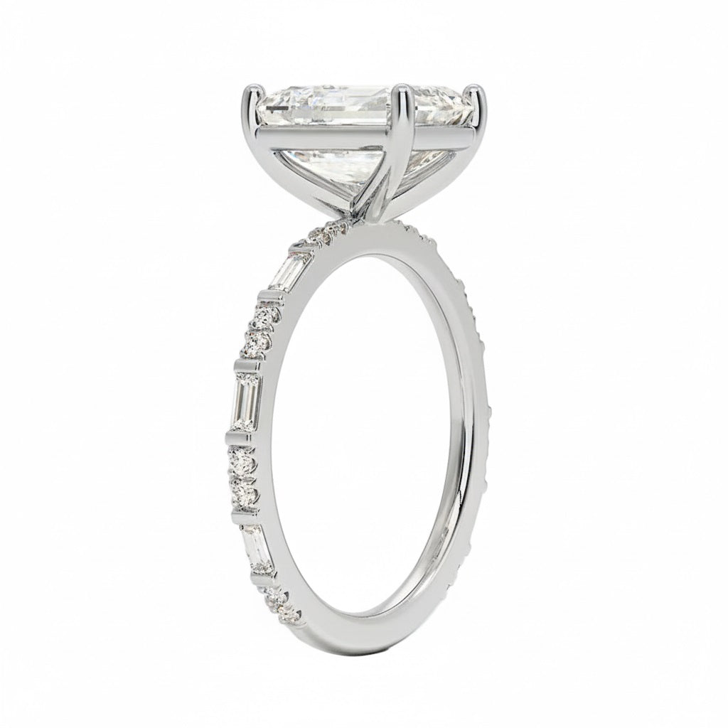 Emerald cut Moissanite lab grown diamond engagement ring with fancy baguette and round cut moissanite set pave gold band, against a white background.Moissanite engagement ring cape town south africa grand diamonds ralph jacobs jeulia 