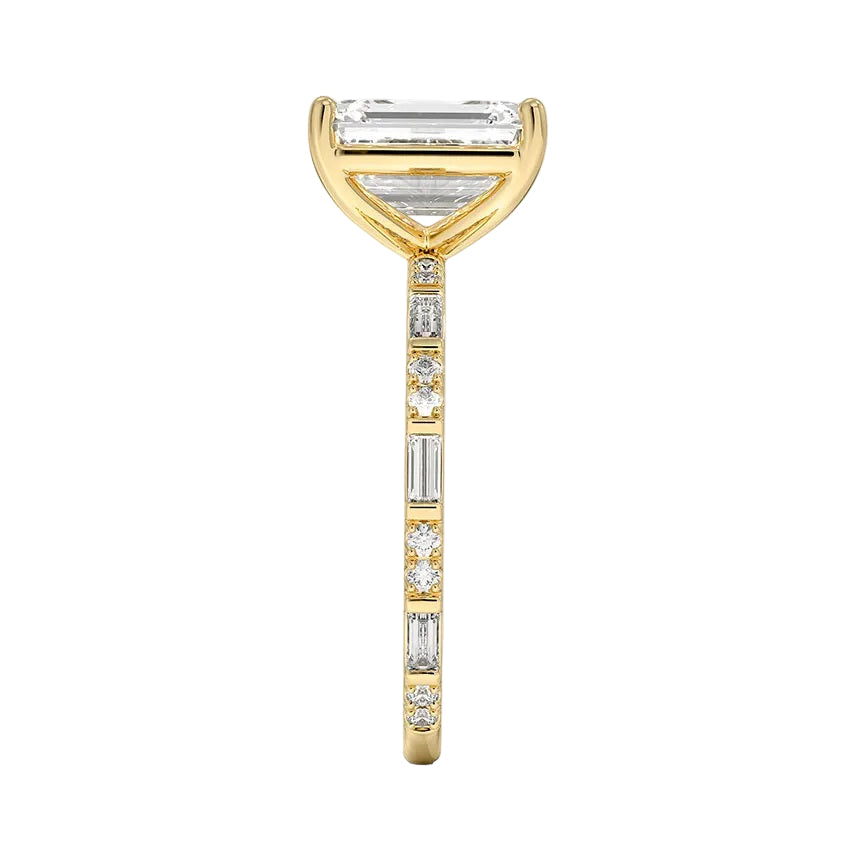 Emerald cut Moissanite lab grown diamond engagement ring with fancy baguette and round cut moissanite set pave gold band, against a white background.Moissanite engagement ring cape town south africa grand diamonds ralph jacobs jeulia 