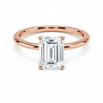 Emerald  cut Moissanite lab grown diamond engagement ring round shank with a four claw setting, on a gold band, against a white background.Moissanite engagement ring cape town south africa grand diamonds ralph jacobs jeulia 