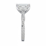 Emerald cut Moissanite lab grown diamond engagement ring with twisted pave set gold shank, against a white background.Moissanite engagement ring cape town south africa grand diamonds ralph jacobs jeulia 