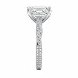 Emerald cut Moissanite lab grown diamond engagement ring with twisted pave set gold shank, against a white background.Moissanite engagement ring cape town south africa grand diamonds ralph jacobs jeulia 